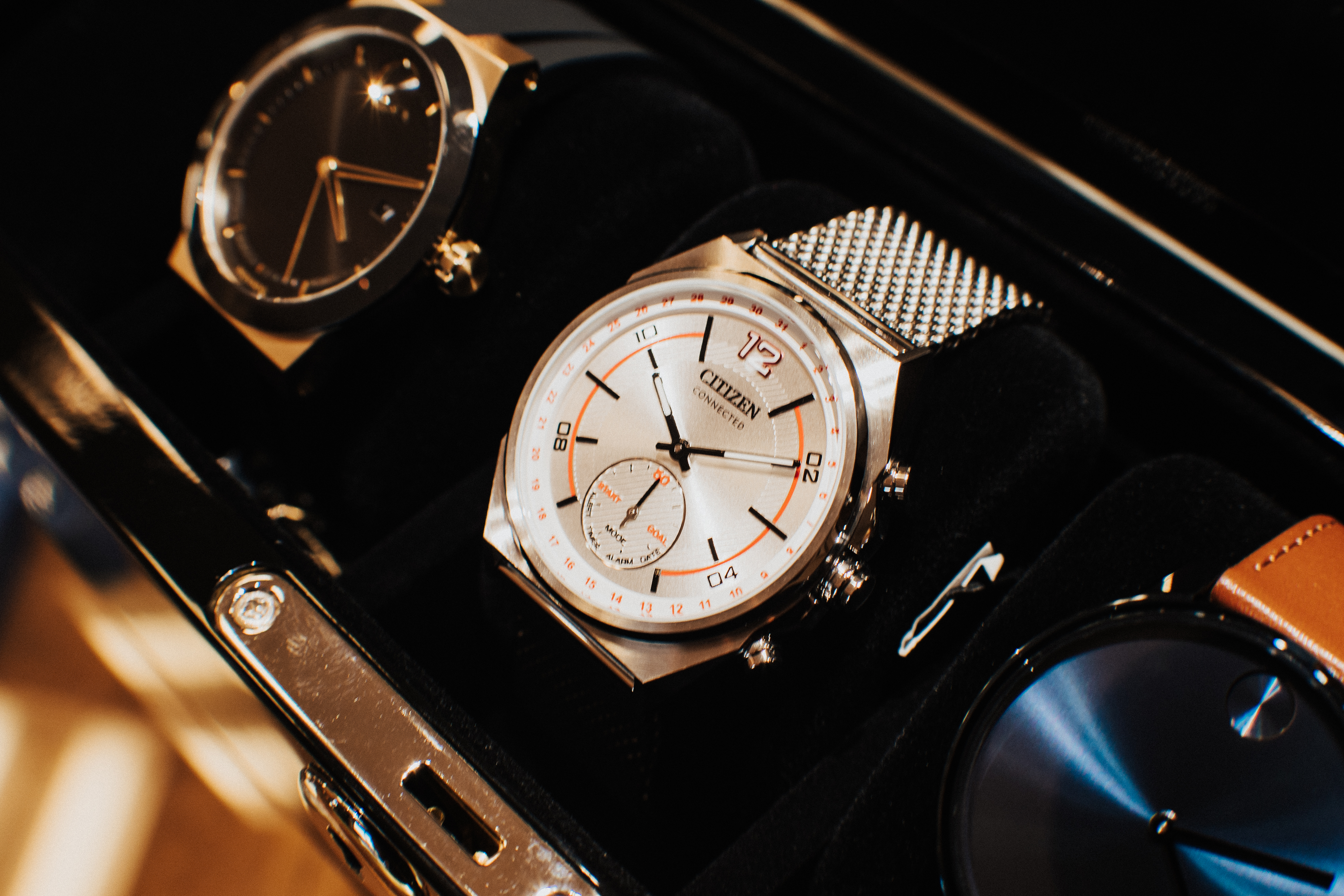 An assortment of men's watches in an elegant case