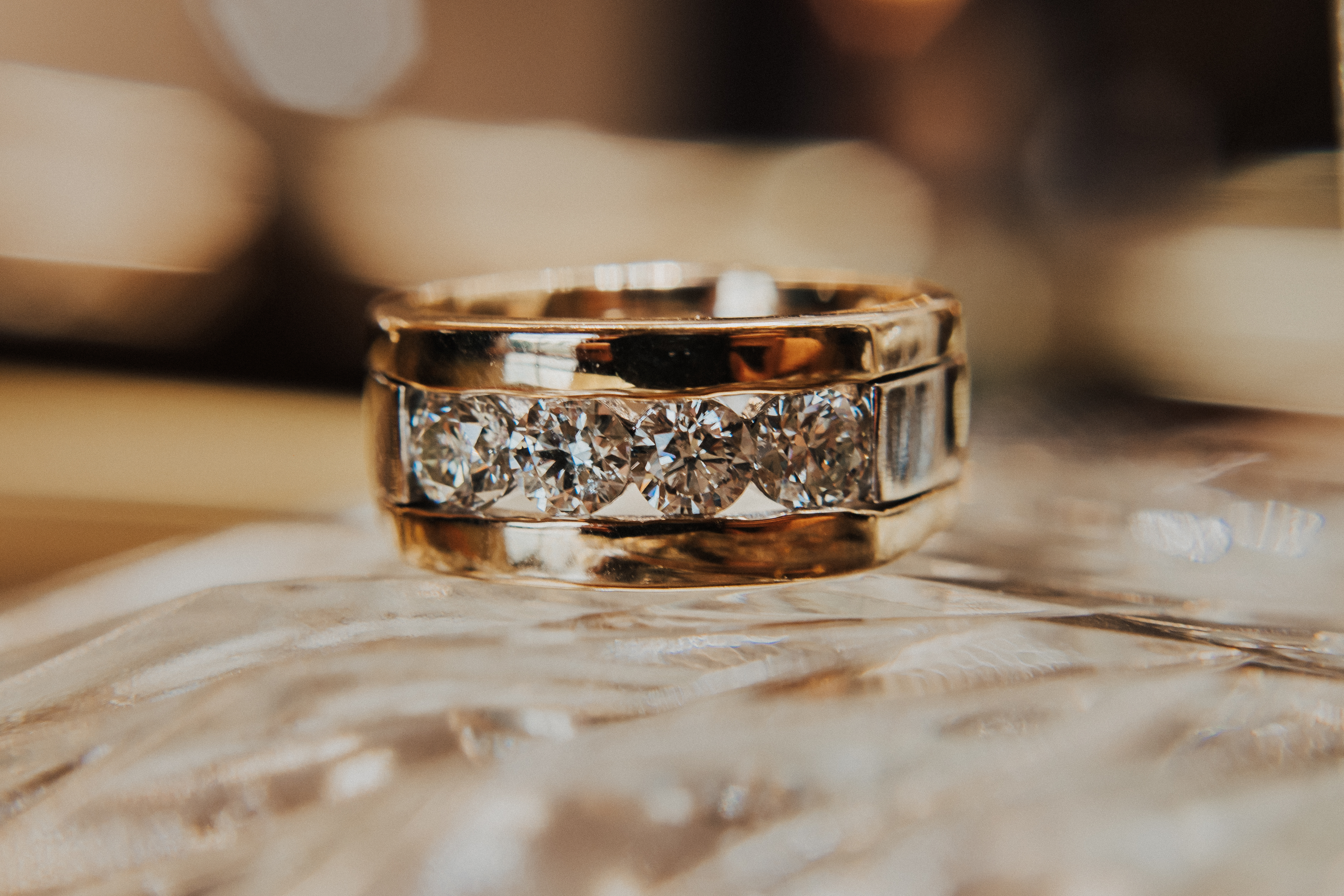 A men's gold ring with inset diamonds